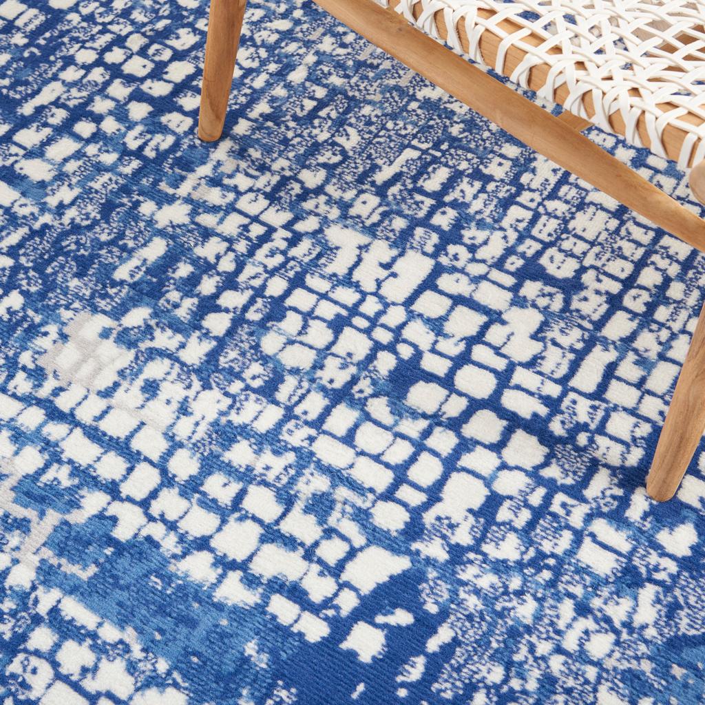 6' X 9' Blue And Ivory Abstract Dhurrie Area Rug