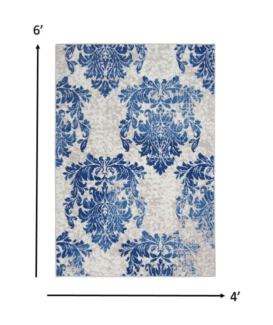 6' X 9' Blue And Ivory Floral Dhurrie Area Rug