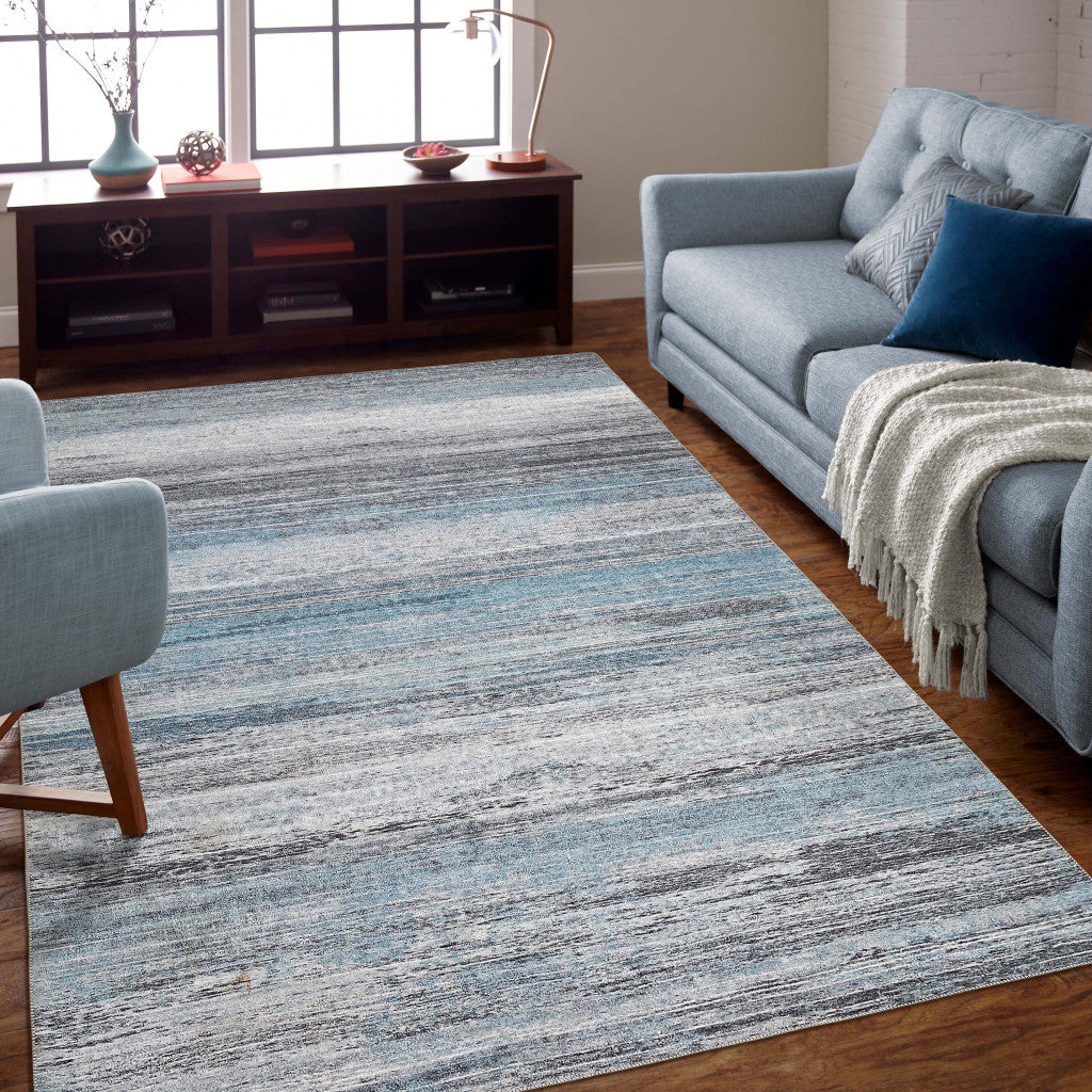 5' X 8' Turquoise and Gray Abstract Stain Resistant Area Rug