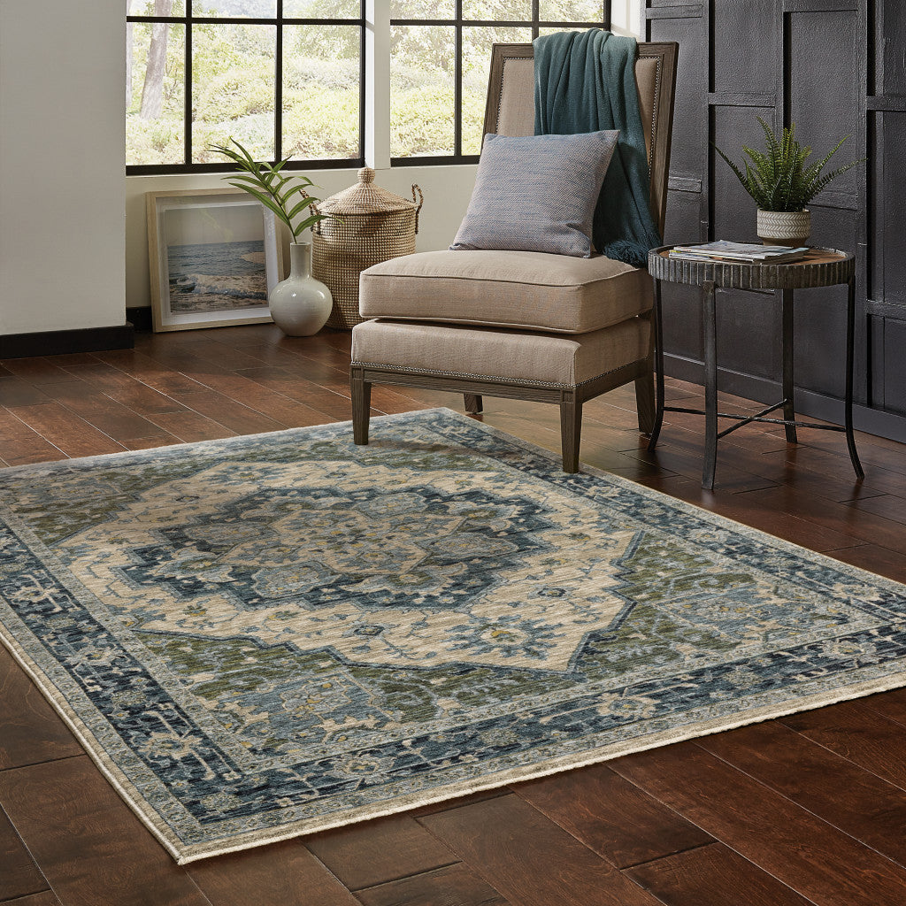 3' X 5' Blue Grey Beige Tan Green And Gold Oriental Power Loom Stain Resistant Area Rug With Fringe