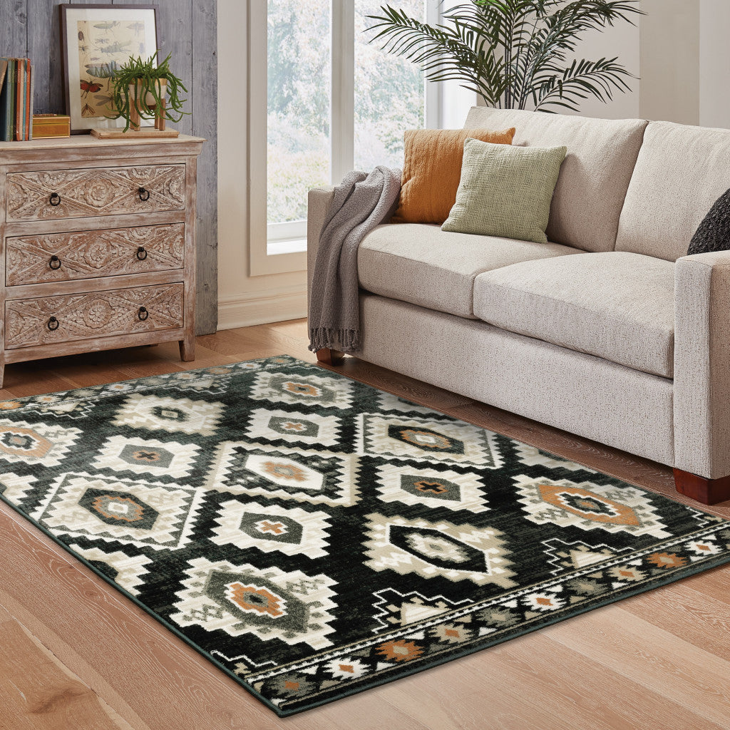 4' X 6' Black Grey Tan Orange And Ivory Southwestern Power Loom Stain Resistant Area Rug