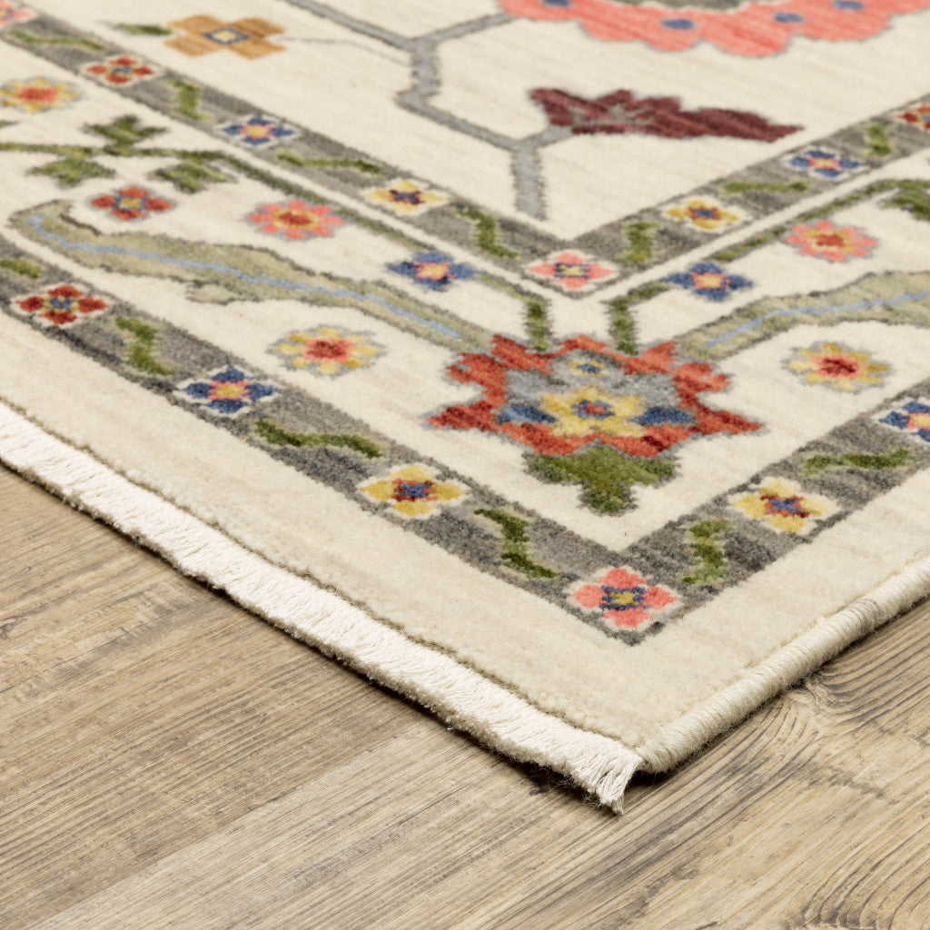 6' X 9' Ivory Green Blues Pink Yellow Rust Brown Tan And Grey Oriental Power Loom Stain Resistant Area Rug With Fringe