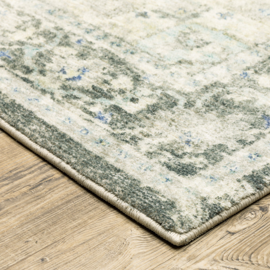 5' X 7' Grey Ivory And Blue Oriental Power Loom Stain Resistant Area Rug