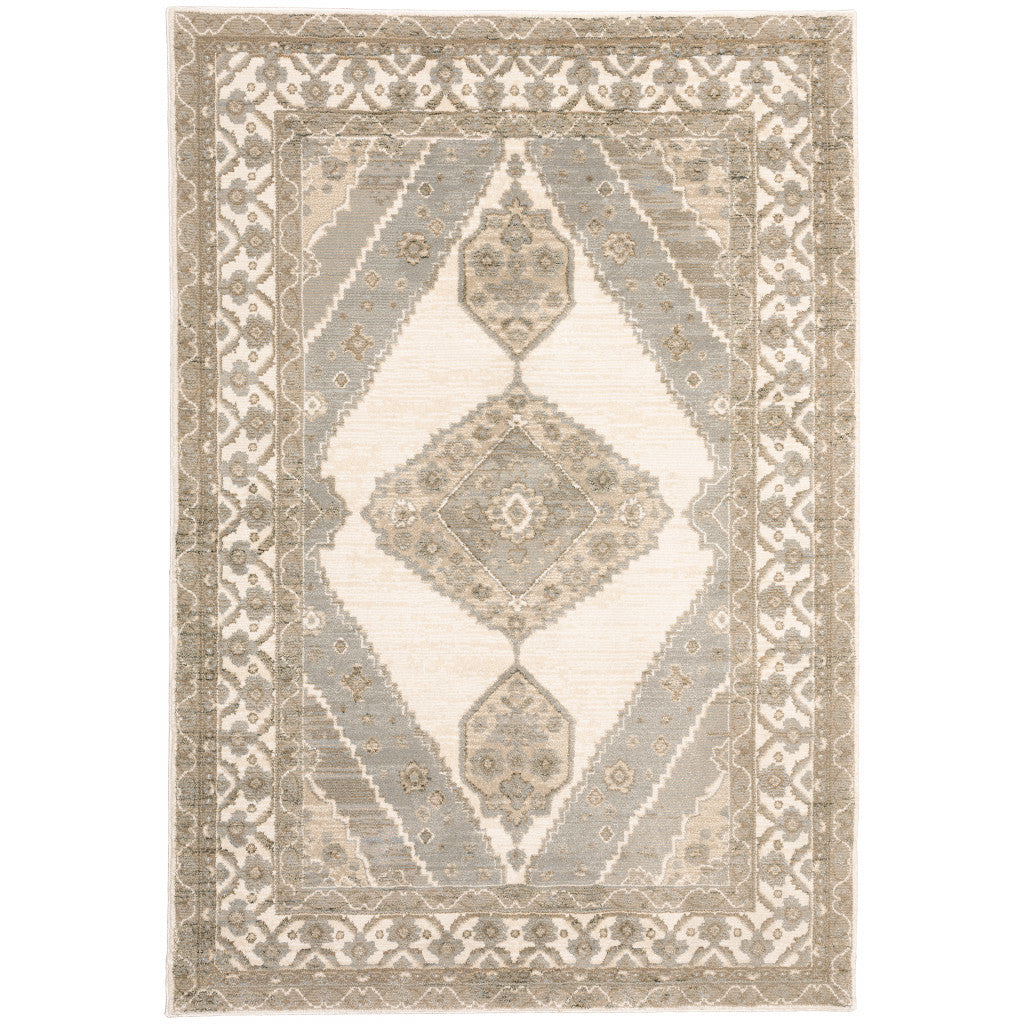 5' X 7' Beige And Ivory Oriental Power Loom Stain Resistant Area Rug