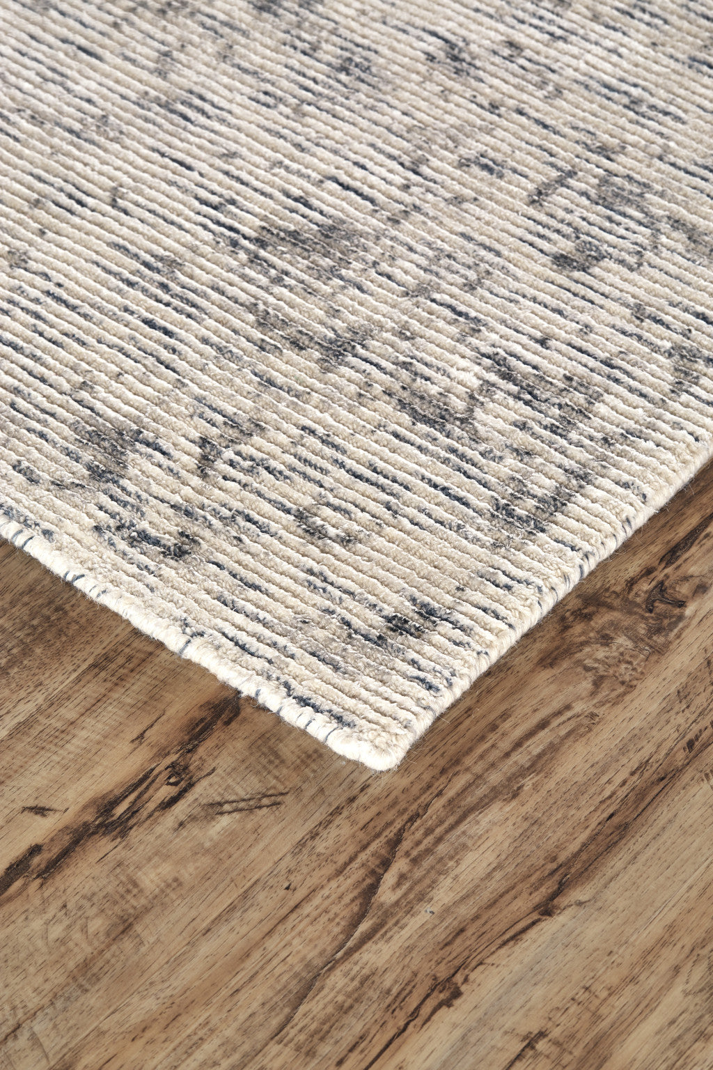 5' X 8' Ivory And Tan Abstract Hand Woven Area Rug