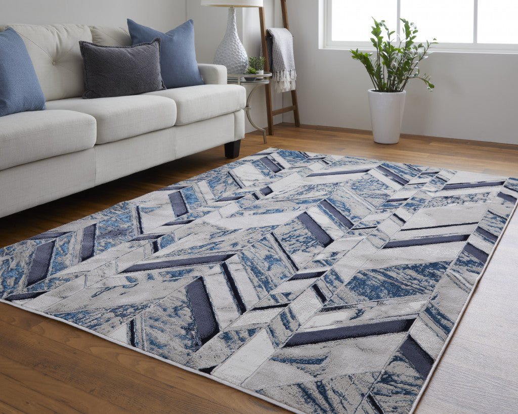 7' X 10' Ivory Blue And Gray Chevron Power Loom Distressed Area Rug